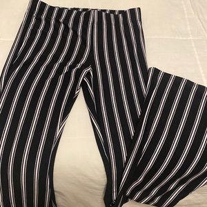 black and white striped stretchy pants, bottoms flare out